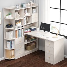 a white desk with bookshelves and drawers in front of a wall mounted window