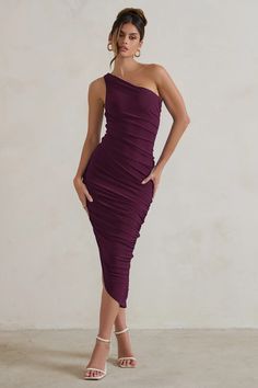 Feminine and versatile, our beautiful Dorit midi dress is a wardrobe must-have. This stunning style features an asymmetric neck and hemline creating an elegant look. The premium jersey fabric and full-body ruching will create a flattering and figure-hugging silhouette. This dress is the perfect option for a cocktail night with the girls or that special event coming up.  Features - Premium stretch jersey - Fully ruched - Bodycon fit - Asymmetric one-shoulder neckline - Asymmetric hemline - Midi length  Sizing & Fit Model is 5'9 and wears UK size 8/ US size 4  Product Information   Double layered with good stretch Premium jersey in Plum (95% Polyester 5% Elastane) 140cm total length SKU: CL129293069 Cocktail Night, Stunning Style, Black Dress Prom, Hugging Silhouette, Black Tie Gala, Party Dress Long Sleeve, Bridesmaid Outfit, Black Sequin Dress