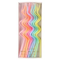 six rainbow colored straws in a box