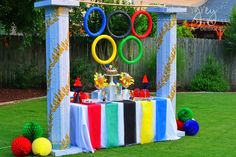 an olympic themed dessert table in the backyard