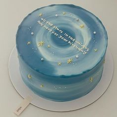 there is a blue cake with stars on it