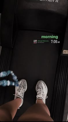 the legs and feet of a person in white sneakers on a treadmill with text reading morning