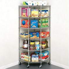 a metal shelving unit with lots of food on it's sides and wheels