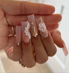 Quince Makeup Looks With Rhinestones, Blush Pink And Gold Quince Nails, Pink Nails Acrylic Quince, Different Types Of 3d Flowers Nails, White French Tip With Gold Diamonds, Rose Gold 15 Nails, Acrylic Nails Ideas Rhinestones, Long Square Acrylic Nails Flowers, Medium Square Birthday Nails