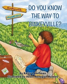 a young boy sitting on the side of a road pointing to a sign that says do you know the way to bikeville?