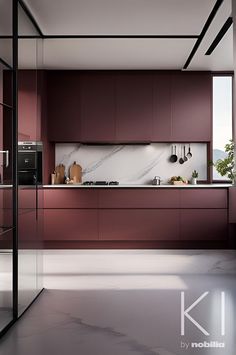 a kitchen with red cabinets and marble counter tops, along with black framed glass doors