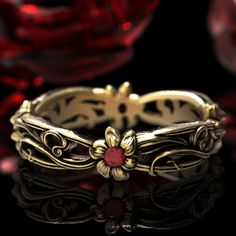 See all variations of this ring: www.etsy.com/shop/doveandbunting?search_query=5108 A flowing Art Nouveau floral pattern. Four dainty flowers, with rubies at their center, are connected through intricately flowing leaves. A simple but elegant design, the graceful and sweeping curves are sure to dazzle you or your lover! Cast in solid gold (yellow, white or rose) or platinum, this ring is made of 100% recycled metal. We make this ring in a polished with patina finish to help the details stand out Flower-shaped Yellow Gold Ruby Ring For Wedding, Flower Shaped Ruby Ring In Yellow Gold For Wedding, Yellow Gold Flower Ruby Ring For Wedding, Yellow Gold Ruby Ring For Wedding With Flower Shape, Ornate Flower-shaped Wedding Jewelry, Art Nouveau 14k Gold Wedding Jewelry, Gold Flower Ruby Ring, Gold Ruby Flower Ring For Anniversary, Wedding Ring Ruby