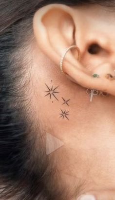 an ear with three small stars on it