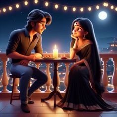 a man and woman sitting at a table in front of a lit candle on a balcony