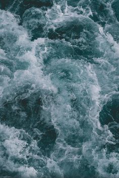 the water is choppy and foamy as it moves through the ocean waves in this photo