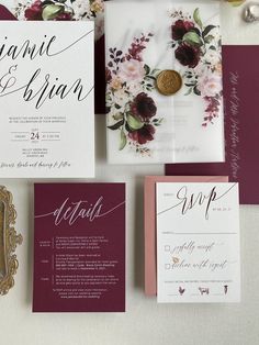 the wedding stationery is laid out on top of each other