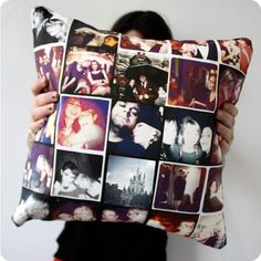 a woman holding a pillow with many pictures on it