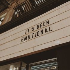 a sign that says it's been emotionally on the side of a theater building