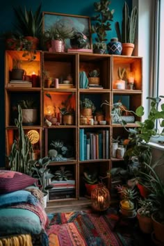 a room filled with lots of different types of plants and potted plants on top of wooden shelves