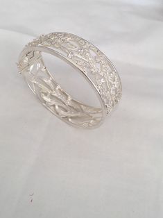 "Amazing Branch Wave Openwork Wide Hinged Bangle Beacelet Front Design Has Cubic Zirconia Stones 925 Sterling Silver Weighs 55 Grams Outside length 2.87\" x 2.38\" Width - 0.87\" New old stock Beautiful new bracelet Visit our shops on Etsy HauteCoutureLaLa TrendsCouture BeautifulPatina LastingTrends Combine shipping within first three shops listedFree Shipping on orders over $35.00 however if there is a return buyer to refund seller for the free shipping cost to seller. BeautifulPatinaFree shipp Silver Crystal Bracelet With Sparkling Stones, Hand Set Cubic Zirconia Sterling Silver Bracelet, Hand Set Sterling Silver Cubic Zirconia Bracelet, Dazzling Silver Bangle Bracelet, Silver Crystal Bracelet Hand Set, Dazzling Silver Bangle Bracelets, Elegant Silver Crystal Bangle Bracelet, Luxury Sparkling Silver Bracelets, Sterling Silver Bangle With Sparkling Stones