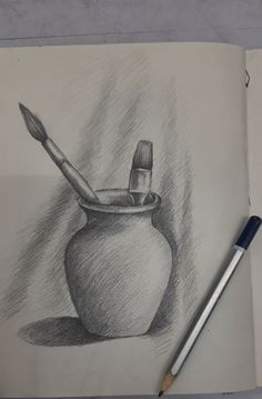 a pencil drawing of a vase with a brush