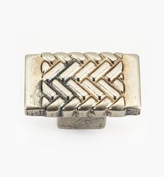 a silver and gold belt buckle on a white background