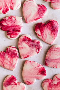 valentine's day cookies with red and white icing in the shape of hearts