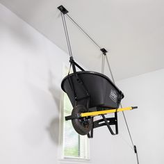 a wheelbarrow hanging from the ceiling in a room