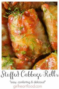 stuffed cabbage rolls with marinara sauce and fresh dill sprigs on top