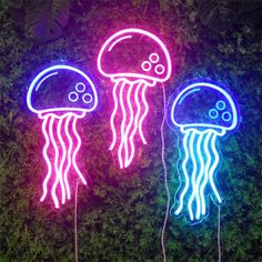 two neon lights that look like jellyfishs