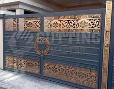 a blue and gold gate with an intricate design