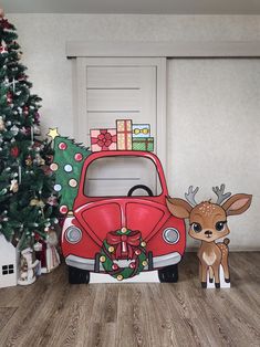 a christmas scene with a red car and deer