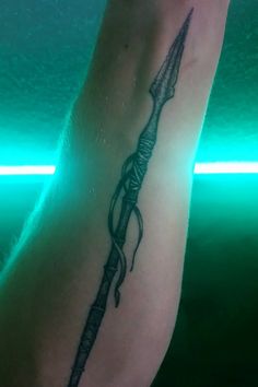 a tattoo on the arm of a person with a bow and arrow in its hand