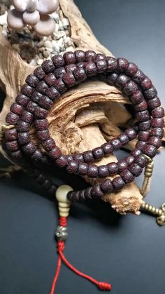 This mala is made by Tibetan craftsmen and come from Hepo Town, Baiyu County,Tibet, the birthplace of the famous Tibetan handicrafts,about 50 years old,blessed by a lama in Baiyu Monastery. ❤ Handmade 108 bodhi beads approximately 8mm,Mala'perimeter is 40cm,15.7inches ❤ 1 pair bead counter,and a Cool Grove pendant ❤ Great Mala For Meditation and Yoga Practitioners ❤ Good karma beads that protect one from negative energy and removes obstacles. Malas are used all over by the Buddhists around.. Red Mala For Meditation With Round Beads, Spiritual Brown Beaded Mala, Traditional Handmade Mala For Meditation, Traditional Mala With Large Beads For Meditation, Brown Spiritual Mala With Round Beads, Lotus Sutra, Om Mani Padme Hum, Good Karma, 108 Mala Beads