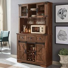 a wooden cabinet with wine glasses on it