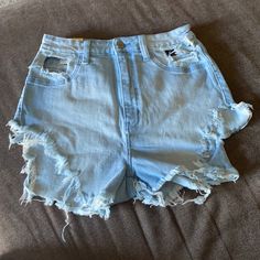 Brand New Run Very Small Blue Stretch Ripped Shorts, Stretch Blue Ripped Shorts, Blue Ripped Stretch Shorts, Stretch Ripped Blue Shorts, Light Blue Ripped Cotton Bottoms, Blue Stretch Cutoff Jean Shorts, High Waist Ripped Blue Bottoms, Trendy Ripped Light Blue Bottoms, Trendy Light Blue Ripped Bottoms