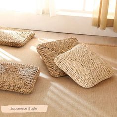 three woven baskets sitting on top of a rug