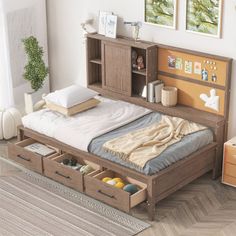 a bed with drawers underneath it in a room