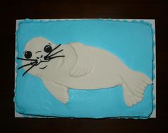 a birthday cake with a seal on it