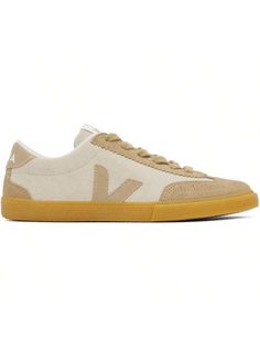 VEJA 
Beige Volley Suede Sneakers 
Low-top paneled PFC-free water-repellent brushed suede sneakers in beige. 
. Perforated detailing at toe 
. Serrated trim at lace-up closure 
. Logo patch at tongue 
. Padded collar 
. Rubberized logo appliqué at sides 
. Logo printed at heel tab 
. re*** polyester jersey lining 
. Treaded rubber sole 
Supplier color: Natural/Sahara 
Upper: leather. Sole: rubber. 
Made in Brazil. 
241610F128018 
Beige Volley Suede Sneakers Default Cool,Sporty        Women Shoes, size features are:Bust: ,Length: ,Sleeve Length: Neutral Lace-up Sneakers With Rubber Sole, Casual Neutral Sneakers With Rubber Sole, Beige Suede Sneakers With Perforated Toe Box, Cream Suede Sneakers With Perforated Toe Box, Beige Sneakers With Gum Sole And Round Toe, Beige Low-top Canvas Sneakers, Beige Sneakers With Vulcanized Sole For Sports, Beige Canvas Sneakers For Sports, Beige Canvas Sporty Sneakers