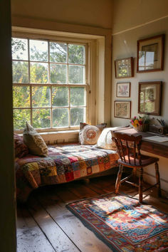 a bedroom with a bed, desk and window