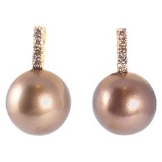 These pearls run the gamut of brown colors! The 18 karat yellow gold mountings are the perfect backdrop for the 10.00 mm Tahitian pearls and the 0.15 carats of brown diamonds. They are secured with a standard friction back. Luxury Yellow Gold Tahitian Pearl Earrings, Texture Reference, Chocolate Pearls, Tahitian Pearl Earrings, Brown Diamonds, Vintage Stud Earrings, Pearl And Diamond Necklace, White Gold Set, Pearl And Diamond Earrings