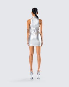 It’s not about looking pretty, it's about looking otherworldly 😏 Made from metallic silver-coated stretch jersey and complete with custom logo hardware trim, a mock neck, and a bodycon fit for a look that will have everyone trying to reach your level ✨ Sleek Fitted Bodycon Dress For Party Season, Sleek Bodycon Dress For Party Season, Glamorous Fitted High Neck Bodycon Dress, Fitted High Neck Mini Dress For Party Season, High Neck Bodycon Dress For Club, Fitted High Neck Bodycon Dress For Club, Modern Fitted Bodycon Party Dress, Modern Bodycon Mini Dress For Party, Silver Sleeveless Bodycon Dress