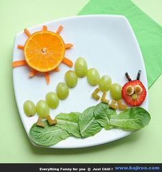 a white plate topped with fruit and vegetables