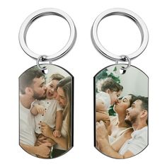 two key chains with an image of a family on them