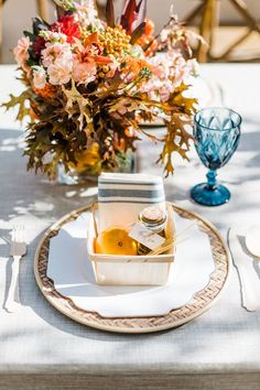 the table is set with an elegant centerpiece