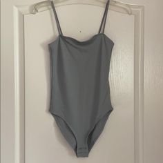 Brand New Never Worn Topshop Grey Bodysuit Fitted Gray Summer Bodysuit, Gray Sleeveless Swimwear For Summer, Sleeveless Gray Swimwear For Summer, Gray Sleeveless Bodysuit For Spring, Gray Casual Summer Bodysuit, Casual Gray Summer Bodysuit, Spring Sleeveless Gray Bodysuit, Fitted Gray Summer Swimwear, Fitted Gray Swimwear For Summer