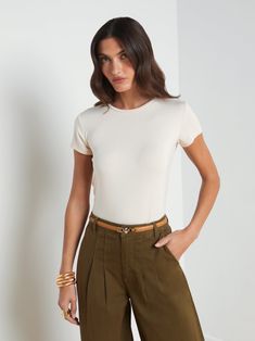 Our most flattering short sleeve tee is here, updated in neutral bisque-beige. In a supple microfiber and slim cut, you'll love how the Ressi crew-neck tee feels and fits. Pair with denim for the ultimate casual-chic look. Try with classic suiting for a fresh spin on professional style. Cashmere Travel Wrap, Designer Clothing Brands, Leather Outerwear, Professional Style, Cardigan Sweater Dress, Dress The Population, Professional Fashion, Womens Loungewear, Cozy Knits