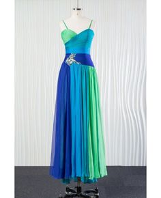 a blue and green dress is on display