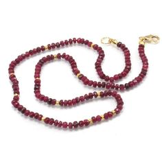 Faceted Ruby Necklace with Gold Plated Accent Beads with Gold Filled Trigger Clasp Approx. 18 inches long Beads ranging from 2x4mm to 3x4mm With Gold Plated Faceted Beads Knotted with silk bead cord Handcrafted at Beads of Paradise NYC Ruby is a pink to blood-red colored gemstone, a variety of the mineral Corundum. The red color is caused mainly by the presence of the element chromium. Its name comes from ruber, which is Latin for red. Other varieties of gem-quality corundum are called Sapphires Ruby Single Strand Beaded Necklaces With Round Beads, Single Strand Ruby Beaded Necklaces With Round Beads, Single Strand Ruby Beaded Necklace With Round Beads, Faceted Bead Necklace, Ruby Necklace, Blood Red, Faceted Bead, Gemstone Colors, Red Color