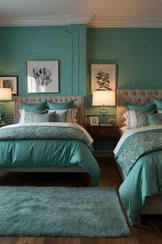 two beds in a room with green walls and blue carpet