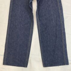 Women’s Lee denim pants Size: 23" x 28" Era: 1940-50s sanforized Cotton Wide Leg Selvedge Pants, Cotton Selvedge Wide Leg Pants, Wide Leg Selvedge Cotton Pants, Selvedge Wide Leg Cotton Pants, Wide Leg Selvedge Denim Pants, Retro Selvedge Bottoms With Standard Cut Leg, Fitted Vintage Denim Blue Pants, Vintage Tapered Leg Jeans With Belt Loops, Retro Dark Wash Selvedge Bottoms