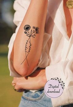 a woman's arm with flowers on it and the words flower written in cursive writing