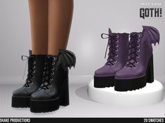 a pair of black and purple boots with dragon wings on the heel are standing next to each other