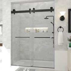 a bathroom with a walk in shower next to a white sink and mirror on the wall